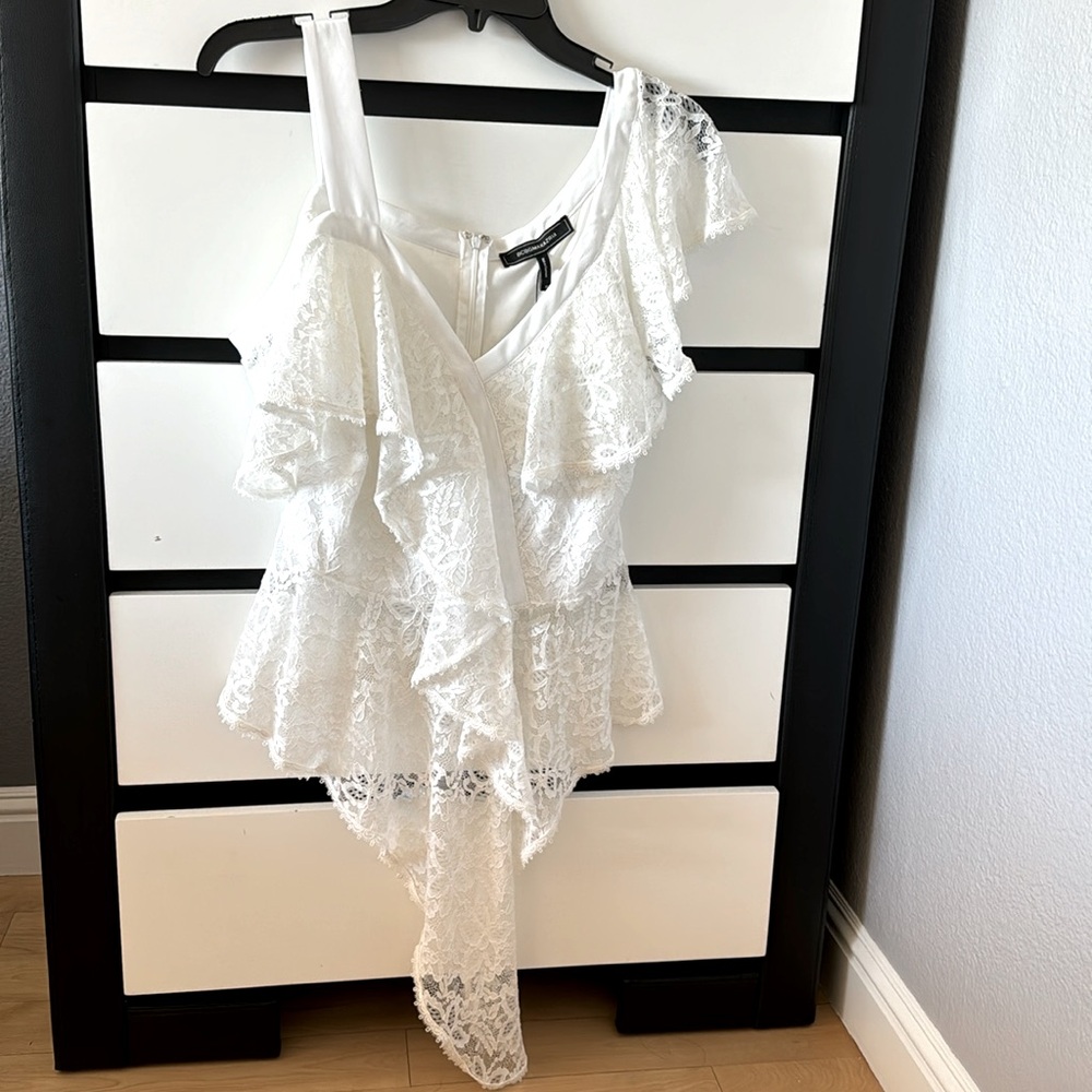 BCBG medium top, white lace, off the shoulder on one side made in Vietnam